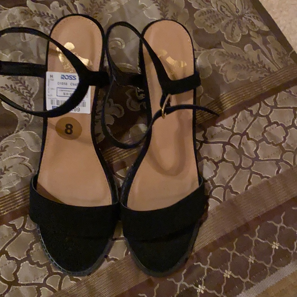 Black shoes with multi colored block heels. Never been worn.